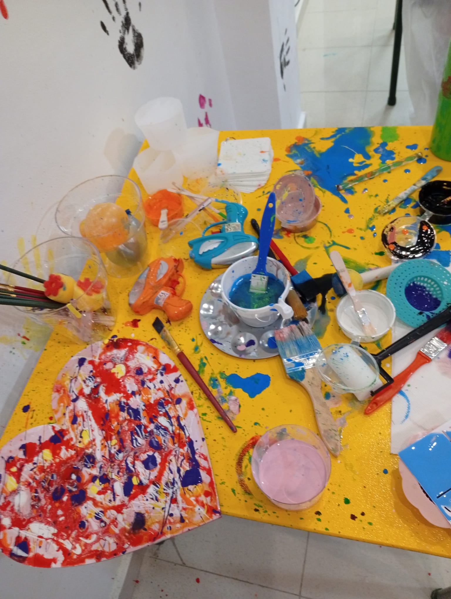 creative art studio messy splatter art canvas paint brush paint sponge